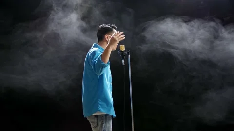 Side View Of Asian Man Rapping Into A Co... | Stock Video | Pond5