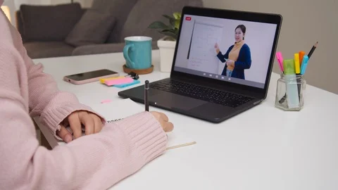 Side view of asian student learning education online at home. Stock Footage 129845276