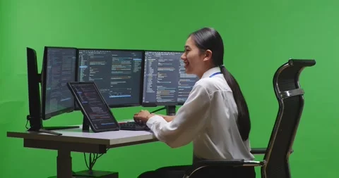 Side View Of Asian Woman Developer Working With Tablet While Write Code With Stock Footage 231162412