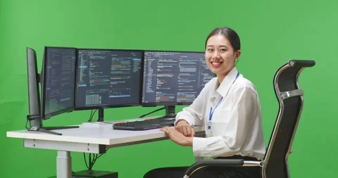 Side View Of Asian Woman Developer Smiling To Camera While Write Code With Stock Footage 231163709