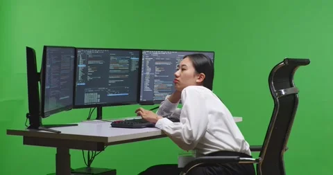 Side View Of Asian Woman Developer Boring While Write Code With Multiple Stock Footage 231164315