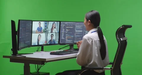 Side View Of Asian Woman Developer Having Video While Write Code With Multiple Stock Footage 231166215