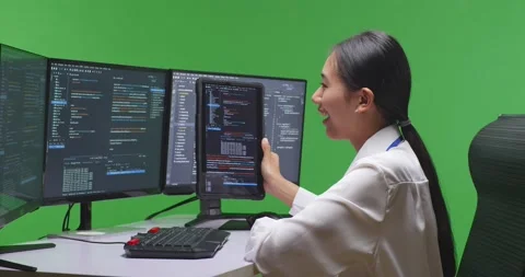 Side View Of Asian Woman Developer Working With Tablet While Write Code With Video stock 231168501