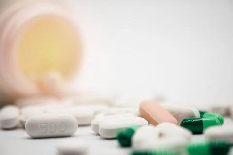 Side view of assorted Pharmaceutical medicine pills, capsules and tablets Stock Photos