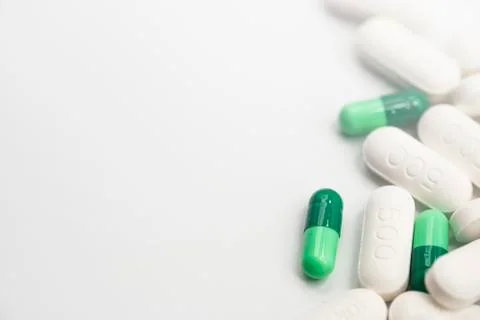 Side view of assorted Pharmaceutical medicine pills, capsules and tablets Stock Photos
