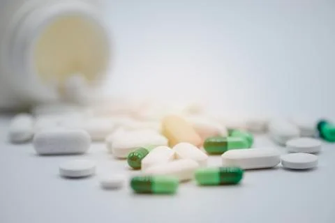 Side view of assorted Pharmaceutical medicine pills capsules and tablets Stock Photos