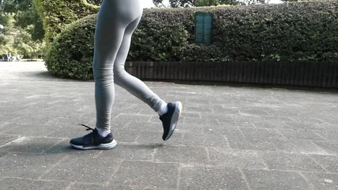 Side view of athletic girl walking Stock Footage 276351548