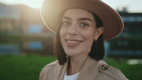 Side View of Attractive young Lady Looking at Camera Wearing Brown Hat on the Stock Footage 263048327
