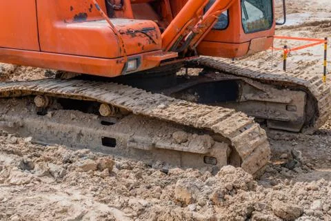 Side view of backhoe tracks Stock Photos