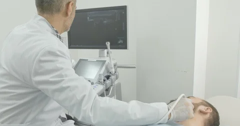 Side view of bearded man face lying on examination in medical cabinet. Doctor Stock Footage 105586793