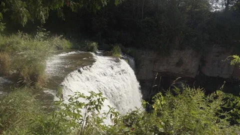 Side view of a beautiful waterfall in the forest. Stock Footage 78954893