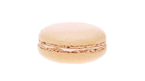 Side view of beige macaroon cookie rotating. Isolated on white background. Stock Footage 161022921
