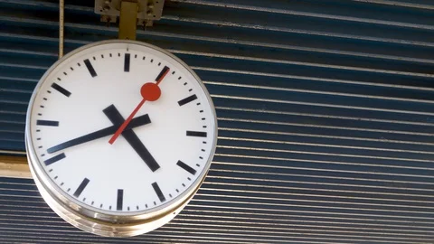 Side view of a big clock in a train station Stock Footage