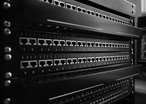 Side view of black clean communication patch panel RJ45 for computer networks Stock Photos
