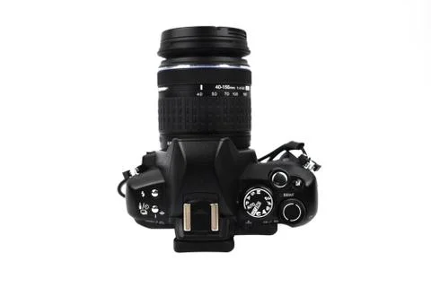 Side view of a black colored camera with lens attached to it on a white backg Stock Photos