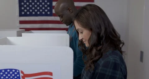 Side view black man and white woman voting in slow motion 4K Stock Footage 114932123