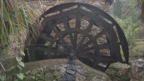Side View of Black water mill and stone foundation. Rotating left to right with Stock Footage 256047058