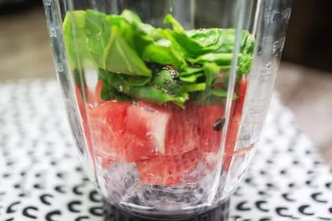 Side view in a blender with spinach, chia, watermelon. Close-up. Stock Photos