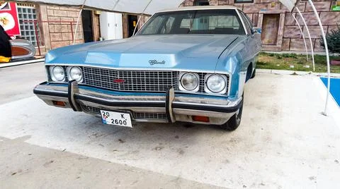 Side view of a blue Cadillac Eldorado under the canopy. careful storage of a Stock Photos