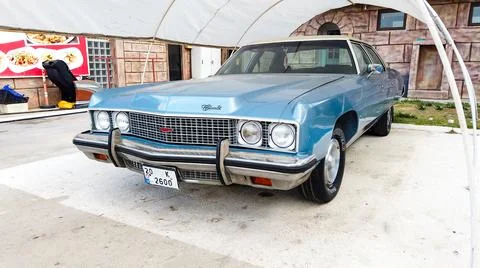 Side view of a blue Cadillac Eldorado under the canopy. careful storage of a Stock Photos