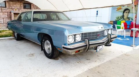 Side view of a blue Cadillac Eldorado under the canopy. careful storage of a Stock Photos