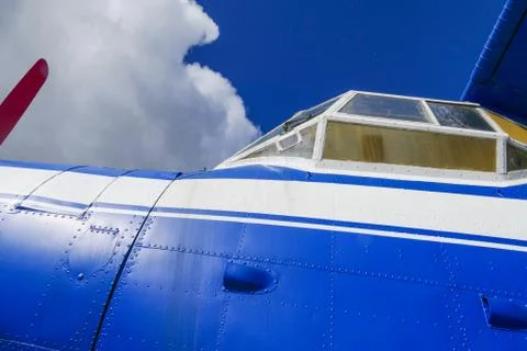 Side view of a blue plane Stock Photos