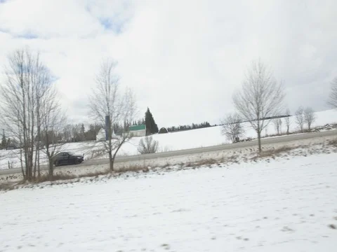 Side View of BMW 435i Driving on Winter Road In Canada - 3 Stock Footage 78213920