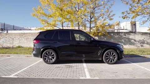 Side view of BMW X5 G05. Parked in a parking lot Stock Footage 254817004