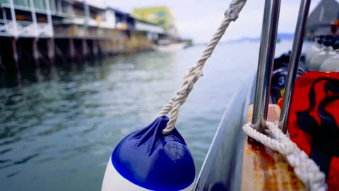 Side View from boat with blue ball slow motion &amp; lens focusing Stock-Footage 136510368