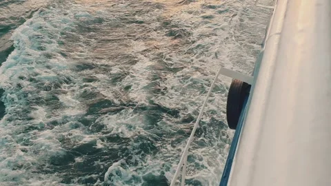 Side view of a boat sailing in the  Sea. Deep blue sea, vessel splits shiny frot Stock Footage 249173207