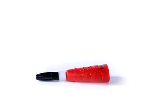 Side view of a bottle of quick drying  super glue laying down Stock Photos