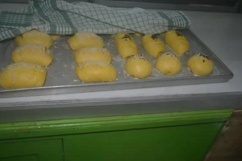 Side view of bread dough placed on an aluminum tray Stock Photos