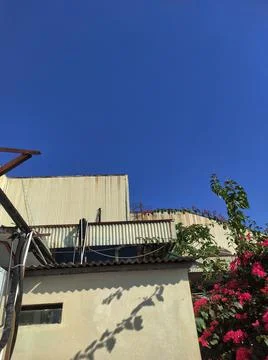 Side view of building with blue sky Stock Photos