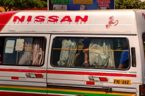Side view of bus ('combi') in New Chimbote Peru showing passenge Stock Photos