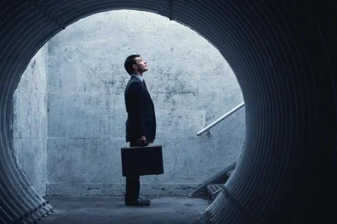 Side view of a businessman looking up there Stock Photos