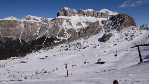 Side view on cableways in front of Dolomites panorama Stock Footage 122527734