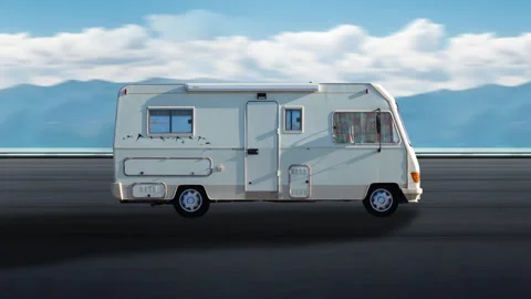 Side view of a Camper driving on highway at high speed, blue sky and mountains. 스톡 동영상 332448318