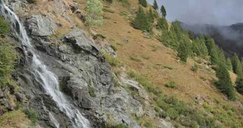 Side view of Capra waterfall in Fagaras mountains, Romania Video stock 298965189