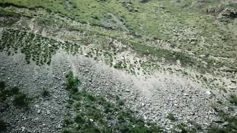 Side view of a car going up an earthen road on a hill from bottom to top. Scene Stock-Footage 136619365
