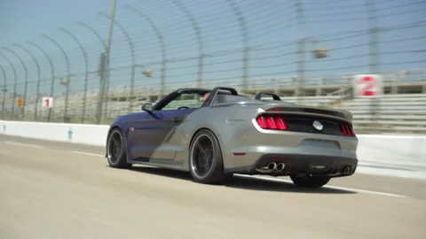 Side view of car speeding on racetrack  Stock Footage 194089229