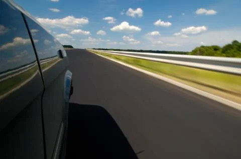 Side view of a car view is a smooth highway Stock Photos