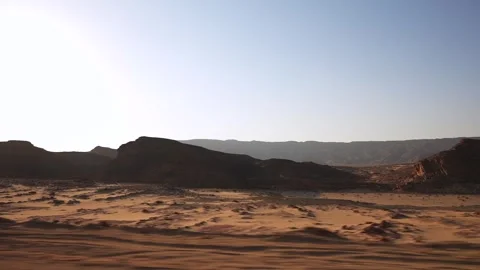 Side view from the car window to the desert roadside. African road trip through Stock Footage 251744474