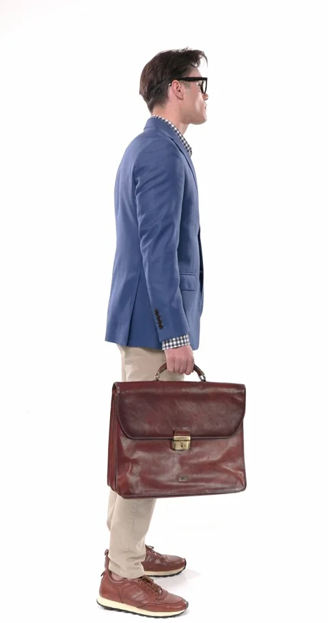 Side view of casual handsome man with glasses holding bag, looking forward and Stock Footage 310043623