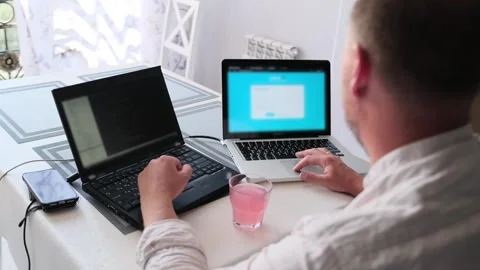 Side view of caucasian man in light shirt passionately typing codes on laptop. Stock Footage 245184367