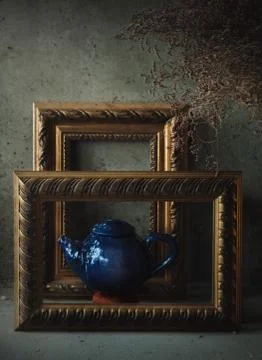 Side view ceramic blue tea pot in picture frames like on painting Stock Photos