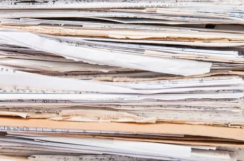 Side view of  chaotic old file stack Stock Photos