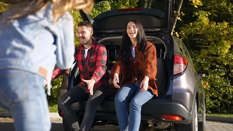 Side view of charming happy young family which having fun together while sitting Stock Footage 121533810
