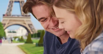 Side view of cheerful couple in Paris chatting and using technology Stock Footage 85806796