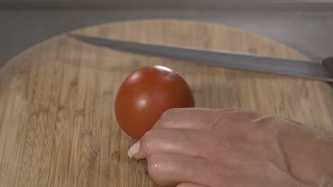 Side view-chef cutting Italian tomatoes to make pasta sauce 4k Stock Footage 96152693