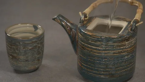 Side View Chef Pouring Hot Water In A Japanese Tea Pot 4 K Video stock 96144504
